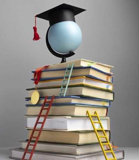 front-view-stacked-books-graduation-cap-ladders-education-day